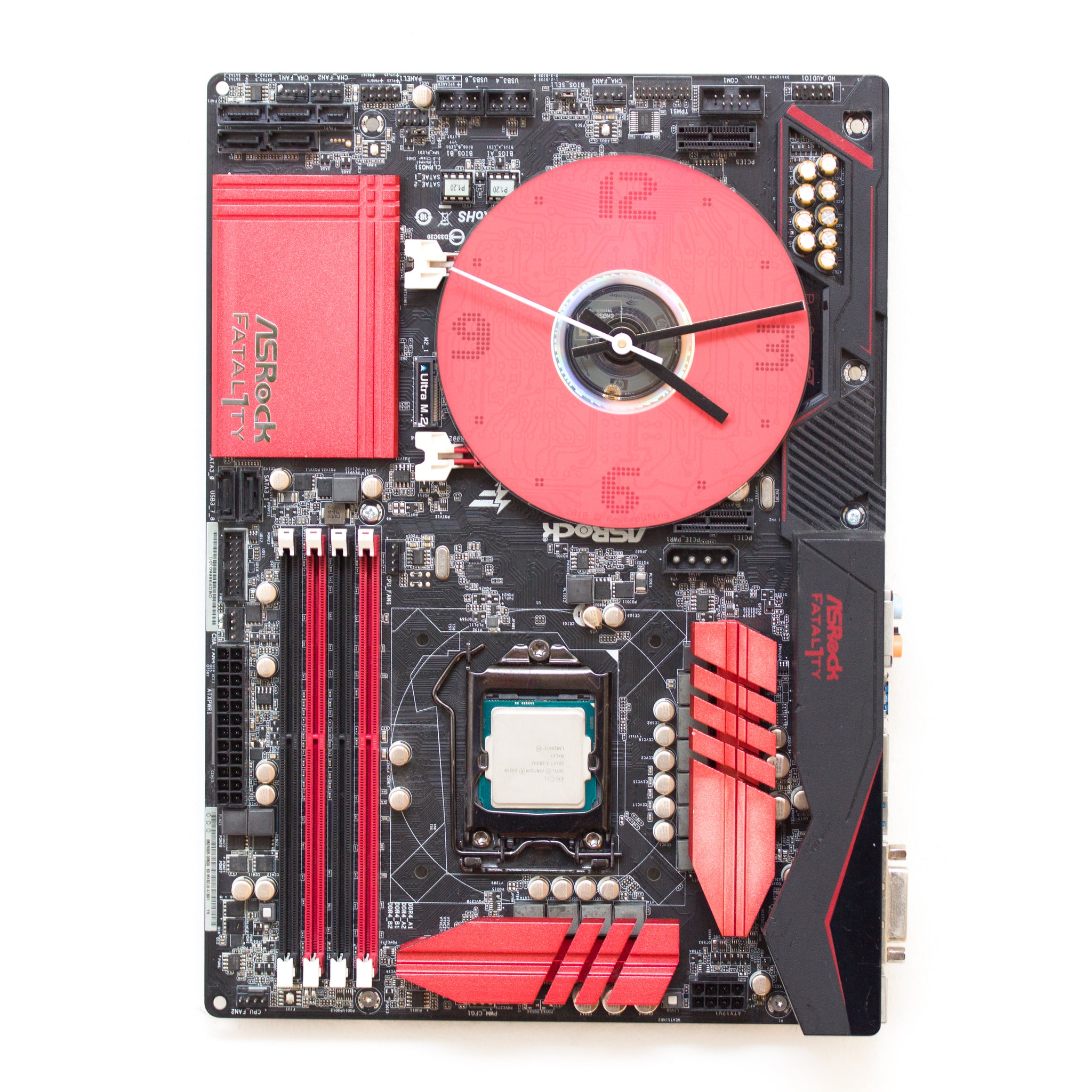 Wall Clock made of a black / dark brown circuit board with a red clock face