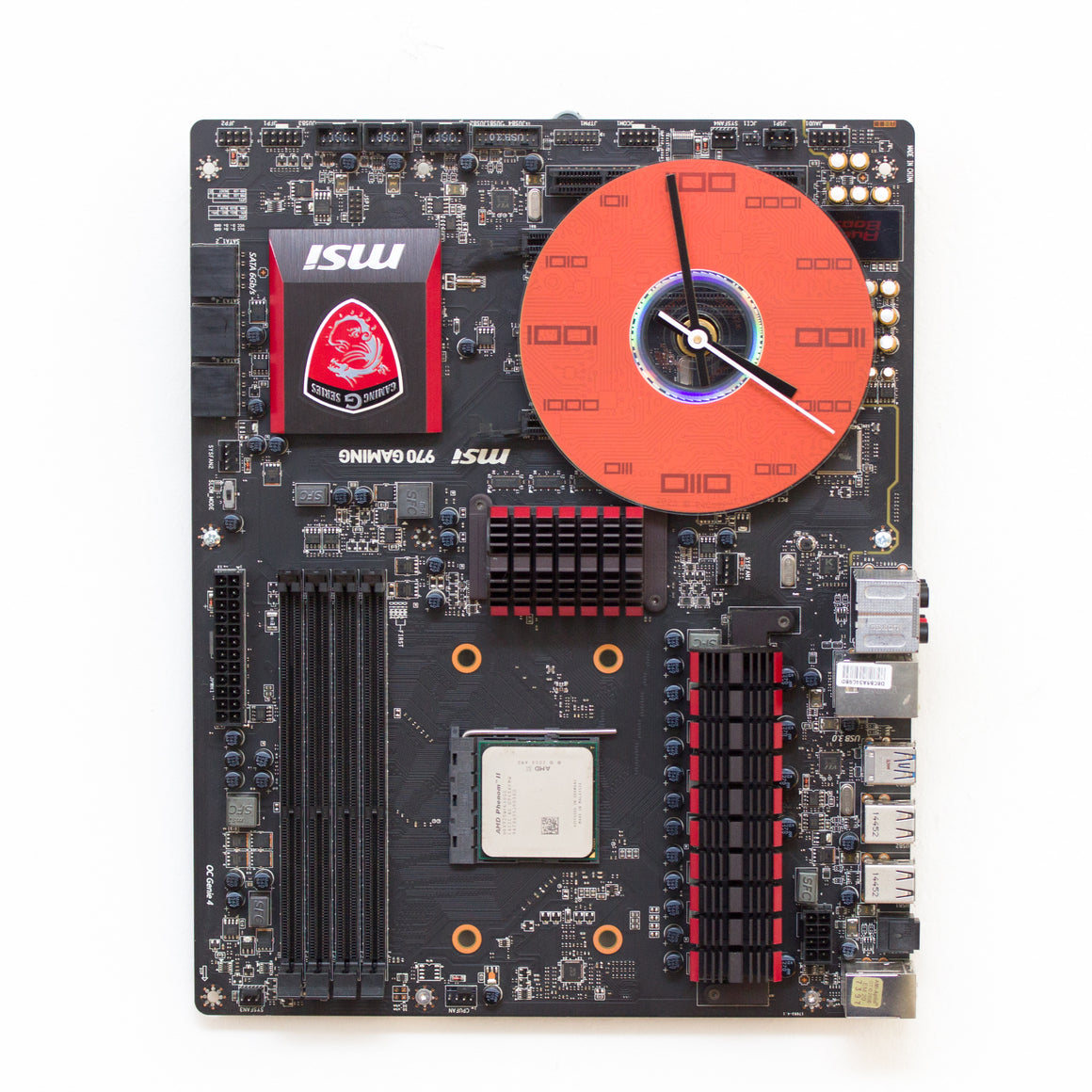 Wall Clock made of a black / dark brown circuit board with a red clock face