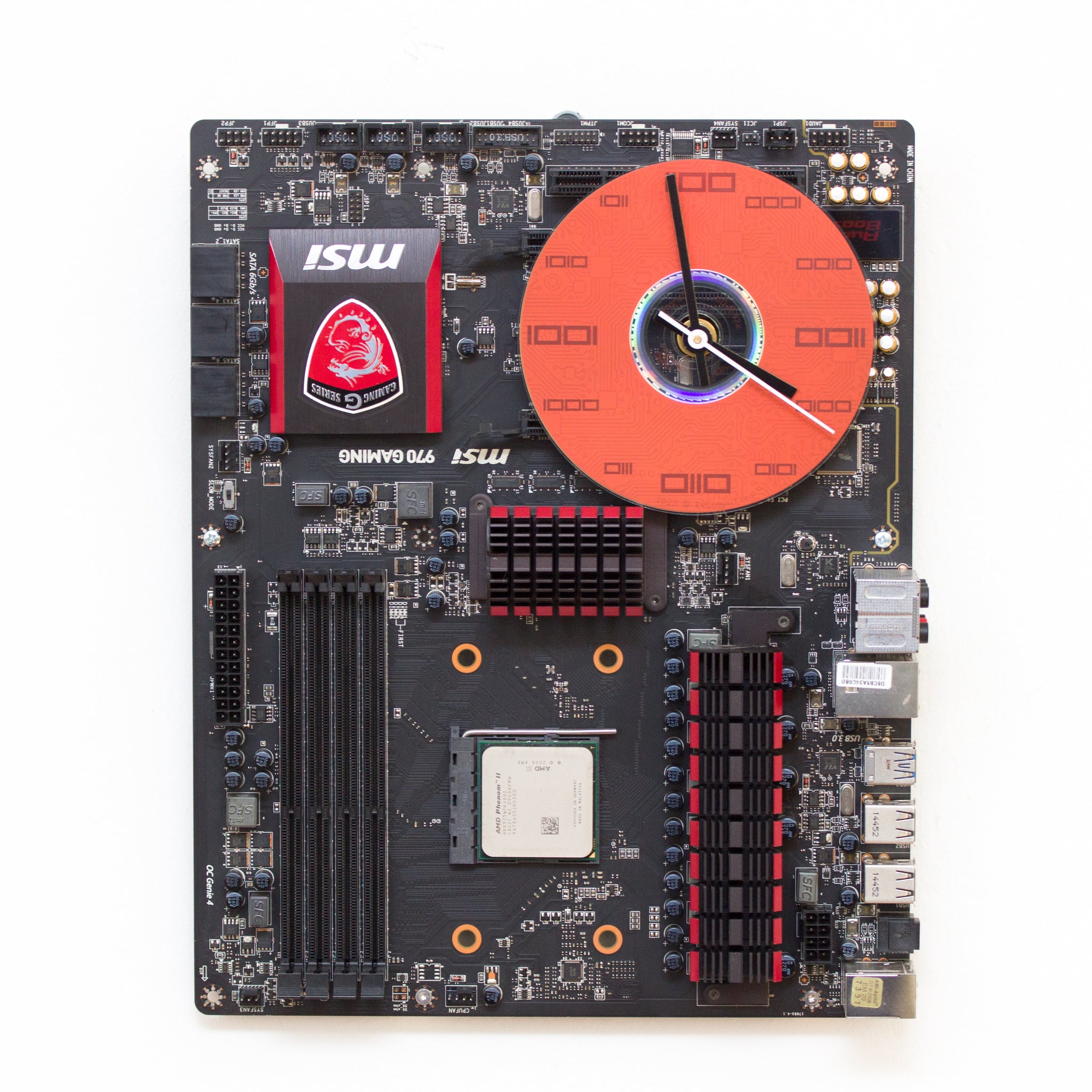 Wall Clock made of a black / dark brown circuit board with a red clock face